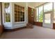 A charming outdoor space with red brick, large windows, and a screened-in porch at 10645 Tuxford Dr, Alpharetta, GA 30022