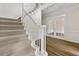 Grand staircase with white railing and carpeted steps, leading to the upper level of the home at 10645 Tuxford Dr, Alpharetta, GA 30022