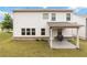 Spacious backyard featuring a covered patio with a barbeque at 1504 Lemon Balm Ct, Lawrenceville, GA 30045