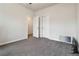 Carpeted bedroom with a ceiling fan and a closet with a set of double doors at 1504 Lemon Balm Ct, Lawrenceville, GA 30045