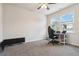 Cozy bedroom featuring a desk and gaming chair by the bright window at 1504 Lemon Balm Ct, Lawrenceville, GA 30045