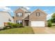 Charming brick home with well-manicured lawn and attached two-car garage, exuding curb appeal at 1504 Lemon Balm Ct, Lawrenceville, GA 30045