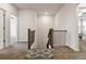 Upstairs hallway with carpeted floors, neutral walls, and stair access at 1504 Lemon Balm Ct, Lawrenceville, GA 30045