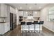 Bright, modern kitchen features stainless steel appliances and a spacious center island at 1504 Lemon Balm Ct, Lawrenceville, GA 30045