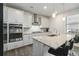 Kitchen includes stainless appliances, granite countertops and an island with seating at 1504 Lemon Balm Ct, Lawrenceville, GA 30045