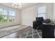 Bright office space featuring large windows, neutral walls, and modern flooring at 1504 Lemon Balm Ct, Lawrenceville, GA 30045