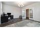 Open office with hardwood floors, a stylish chandelier, and double doors at 1504 Lemon Balm Ct, Lawrenceville, GA 30045