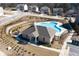 Exterior shot of community pool with pool house and neighborhood homes in the background at 1504 Lemon Balm Ct, Lawrenceville, GA 30045