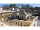 Exterior shot of community pool with neighborhood homes in the background at 1504 Lemon Balm Ct, Lawrenceville, GA 30045