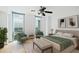 Bright bedroom with plush bed, comfortable chairs, and large windows offering a view of the surrounding city at 2870 Pharr Court South Nw # 1704, Atlanta, GA 30305