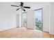 Bedroom with hardwood floors, white walls, and large windows with city views at 2870 Pharr Court South Nw # 1704, Atlanta, GA 30305