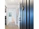 Hallway view shows the kitchen and living areas of this condominium at 2870 Pharr Court South Nw # 1704, Atlanta, GA 30305
