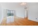 Bright living room with hardwood floors, large windows with a city view and a flush mount light fixture at 2870 Pharr Court South Nw # 1704, Atlanta, GA 30305