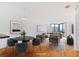 Inviting, virtually staged living room featuring modern furnishings and ample natural light with views of the city at 2870 Pharr Court South Nw # 1704, Atlanta, GA 30305