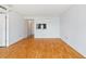 Living room with hardwood floors, access to the kitchen, white walls and recessed lighting at 2870 Pharr Court South Nw # 1704, Atlanta, GA 30305