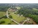 Aerial view of sprawling wooded acreage with home and garage at 4067 Mason Creek Rd, Winston, GA 30187