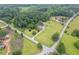Aerial view of a house on a large grassy lot, complete with a pool and mature trees at 4067 Mason Creek Rd, Winston, GA 30187