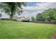 An expansive backyard with lush green grass and a wooden fence surrounding the property at 4067 Mason Creek Rd, Winston, GA 30187