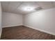 A finished basement featuring wood-look flooring and a neutral color palette at 4067 Mason Creek Rd, Winston, GA 30187