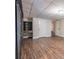 Finished basement with wood-look flooring and built-in desk near a stairway at 4067 Mason Creek Rd, Winston, GA 30187