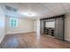 Basement space with built-in sliding door shelving and wood-look floors at 4067 Mason Creek Rd, Winston, GA 30187