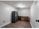 Finished basement showcasing wood-look flooring, safe, and desk setup at 4067 Mason Creek Rd, Winston, GA 30187