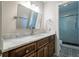 Bathroom featuring modern vanity with a marble countertop and a subway tiled walk-in shower at 4067 Mason Creek Rd, Winston, GA 30187