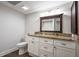 Bathroom with granite countertops, white cabinets, and wood-look flooring at 4067 Mason Creek Rd, Winston, GA 30187