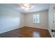 Bedroom with hardwood floors, ceiling fan, and plantation shutters, providing natural light and comfort at 4067 Mason Creek Rd, Winston, GA 30187
