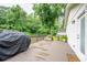 A spacious wooden deck that overlooks a private backyard, perfect for outdoor entertaining at 4067 Mason Creek Rd, Winston, GA 30187