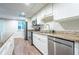 Kitchen featuring stainless steel appliances, granite countertops, and white cabinets at 4067 Mason Creek Rd, Winston, GA 30187