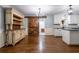 Charming kitchen with white cabinets, modern lighting, and sliding barn door at 4067 Mason Creek Rd, Winston, GA 30187