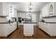 Stylish kitchen with white cabinets, a center island, and stainless steel appliances at 4067 Mason Creek Rd, Winston, GA 30187