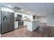 Stainless steel appliances and a large center island in a kitchen area at 4067 Mason Creek Rd, Winston, GA 30187