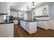 Modern kitchen with white cabinets, black countertops, and stainless steel appliances at 4067 Mason Creek Rd, Winston, GA 30187