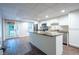 Modern kitchen with center island, stainless appliances, and access to backyard at 4067 Mason Creek Rd, Winston, GA 30187