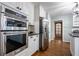 Modern kitchen features stainless steel appliances and white cabinets at 4067 Mason Creek Rd, Winston, GA 30187