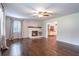 Spacious living room with hardwood floors, fireplace, and ample natural light at 4067 Mason Creek Rd, Winston, GA 30187