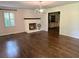 Spacious living room with hardwood floors, fireplace, and neutral paint at 4067 Mason Creek Rd, Winston, GA 30187