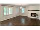 Bright living room with hardwood floors, brick fireplace and plantation shutters at 4067 Mason Creek Rd, Winston, GA 30187