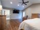 Spacious main bedroom featuring vaulted ceilings, a TV, wood floors, and a door to the outside at 4067 Mason Creek Rd, Winston, GA 30187