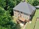 Aerial view of a home featuring a wooden deck and spacious backyard at 4895 Smokestone Dr, Douglasville, GA 30135