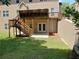 A large backyard featuring a wooden deck with stairs and a walkout basement with french doors at 4895 Smokestone Dr, Douglasville, GA 30135