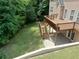 An elevated back deck overlooks an ample backyard perfect for recreation and entertaining at 4895 Smokestone Dr, Douglasville, GA 30135