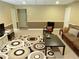 A large basement living room provides ample space for relaxing and entertaining at 4895 Smokestone Dr, Douglasville, GA 30135