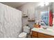 Bathroom featuring a shower with a white curtain, a vanity, and shelves at 4895 Smokestone Dr, Douglasville, GA 30135