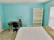 Bright bedroom featuring a desk, bookshelf, neutral carpet, and a large window at 4895 Smokestone Dr, Douglasville, GA 30135