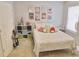 Bedroom with decorative wall art above a neatly made bed with a white comforter at 4895 Smokestone Dr, Douglasville, GA 30135