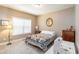 Bright bedroom with neutral tones, a sewing machine, and a window offering ample natural light at 4895 Smokestone Dr, Douglasville, GA 30135