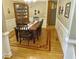 Elegant dining room with hardwood floors, wainscoting, and a classic chandelier at 4895 Smokestone Dr, Douglasville, GA 30135